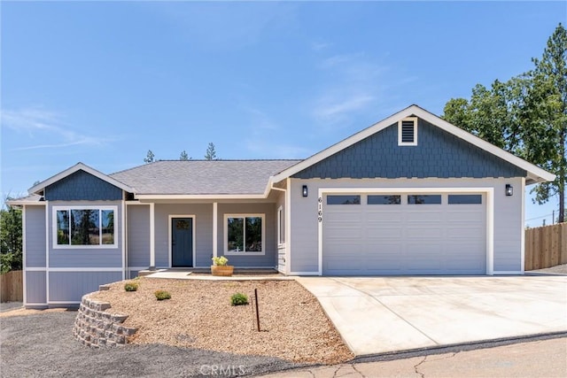 6169 Fern Ln, Paradise, CA 95969 - ranch-style house featuring an attached garage, driveway, and covered porch