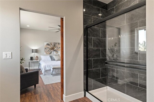 6169 Fern Ln, Paradise, CA 95969 - bathroom with wood finished floors, connected bathroom, and a stall shower