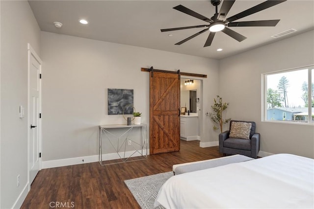 6169 Fern Ln, Paradise, CA 95969 - bedroom with a barn door, wood finished floors, recessed lighting, ensuite bathroom, and a ceiling fan