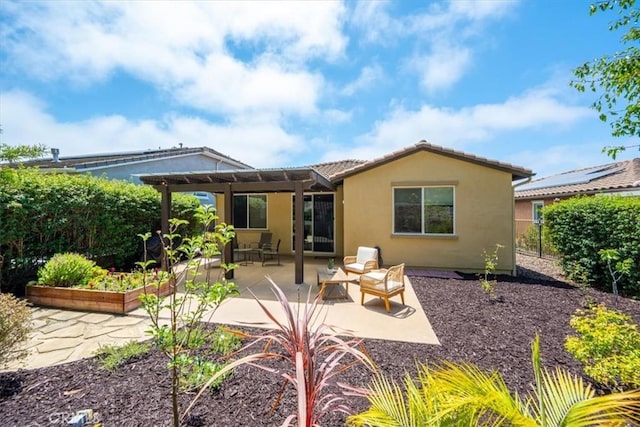 1061 Ford Dr, Nipomo, CA 93444 - back of property with a garden, stucco siding, a patio area, and a pergola