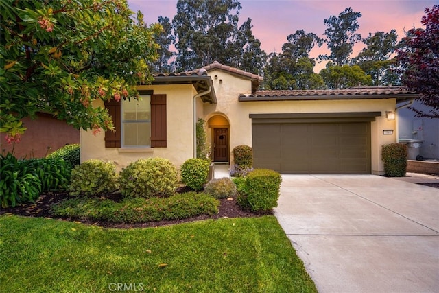 1061 Ford Dr, Nipomo, CA 93444 - mediterranean / spanish-style home with stucco siding, driveway, a garage, and a tiled roof