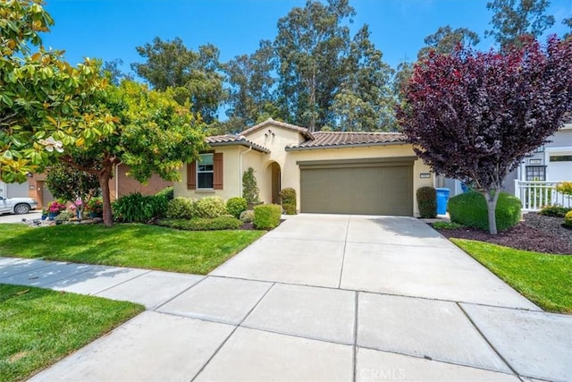1061 Ford Dr, Nipomo, CA 93444 - mediterranean / spanish home with an attached garage, stucco siding, a tiled roof, concrete driveway, and a front yard