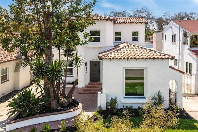 4325 9th Ave, Los Angeles, CA 90008 - mediterranean / spanish-style home with a tiled roof and stucco siding