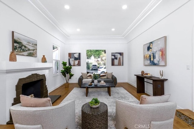 4325 9th Ave, Los Angeles, CA 90008 - living area with crown molding, wood finished floors, a fireplace, and recessed lighting