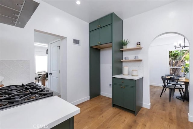 4325 9th Ave, Los Angeles, CA 90008 - kitchen featuring green cabinets, light countertops, light wood-type flooring, and recessed lighting