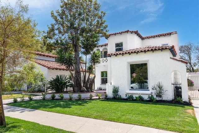 4325 9th Ave, Los Angeles, CA 90008 - view of front facade with stucco siding, a tiled roof, and a front yard