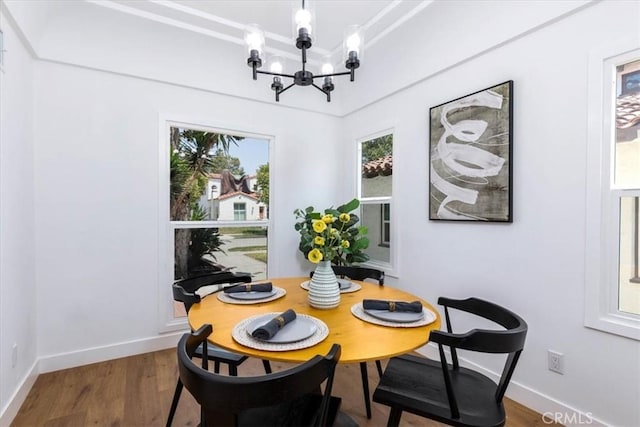 4325 9th Ave, Los Angeles, CA 90008 - dining room featuring a chandelier and wood finished floors