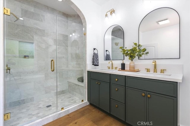 4325 9th Ave, Los Angeles, CA 90008 - full bathroom featuring double vanity, a shower stall, and wood finished floors