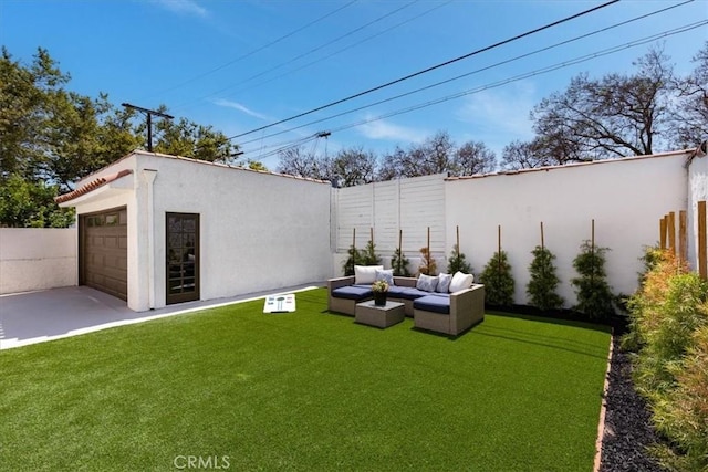 4325 9th Ave, Los Angeles, CA 90008 - fenced backyard featuring an outdoor living space, an outdoor structure, a patio, and a garage