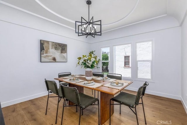 4325 9th Ave, Los Angeles, CA 90008 - dining room featuring a chandelier, wood finished floors, and a raised ceiling