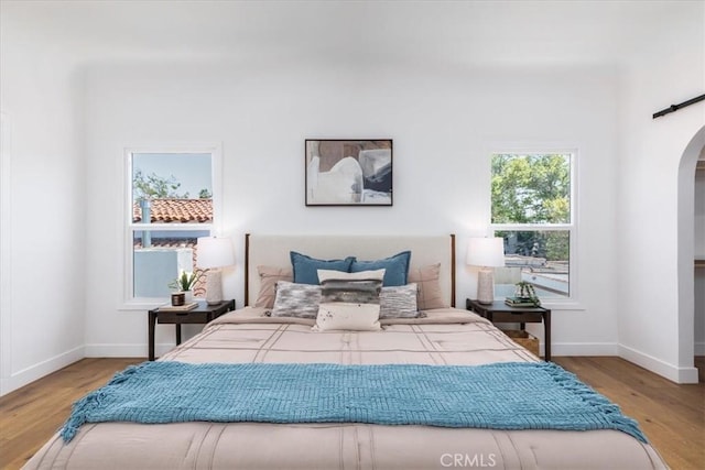 4325 9th Ave, Los Angeles, CA 90008 - bedroom with arched walkways and wood finished floors