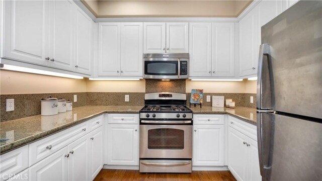 66 Full Moon, Irvine, CA 92618 - kitchen featuring appliances with stainless steel finishes and white cabinets