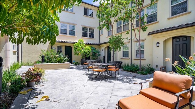 66 Full Moon, Irvine, CA 92618 - view of patio featuring outdoor dining area