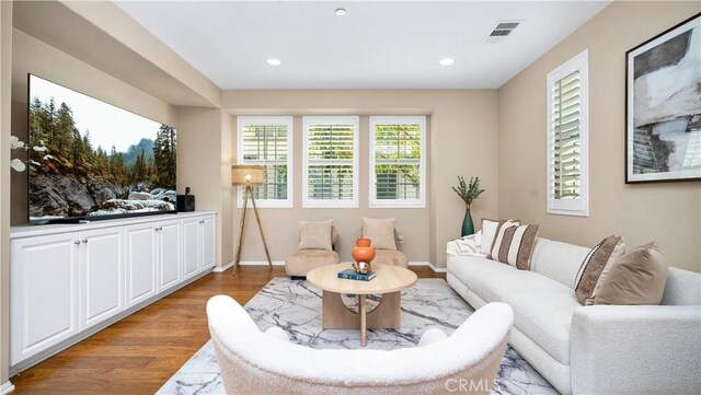 66 Full Moon, Irvine, CA 92618 - living room featuring light wood-style flooring and recessed lighting