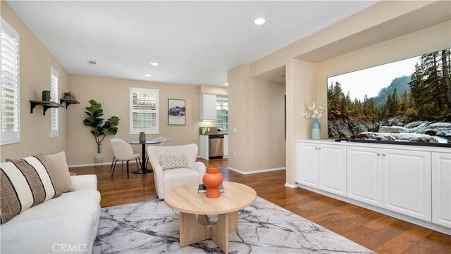 66 Full Moon, Irvine, CA 92618 - living room with light wood-style flooring and recessed lighting