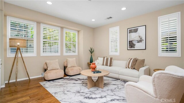 66 Full Moon, Irvine, CA 92618 - living area featuring wood finished floors and recessed lighting
