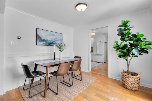 2322 246th St, Lomita, CA 90717 - dining room with light wood-style floors and ornamental molding