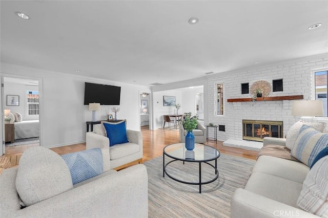 2322 246th St, Lomita, CA 90717 - living room with a fireplace, light wood-type flooring, and recessed lighting