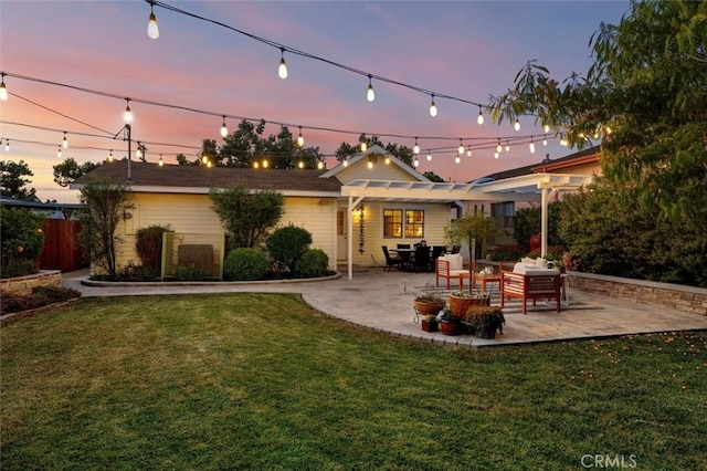 2322 246th St, Lomita, CA 90717 - back of property at dusk featuring a pergola and a patio area