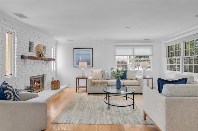 2322 246th St, Lomita, CA 90717 - living area featuring a fireplace, wood finished floors, and crown molding