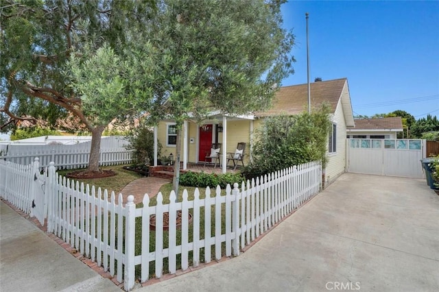 2322 246th St, Lomita, CA 90717 - view of property hidden behind natural elements featuring covered porch and a fenced front yard
