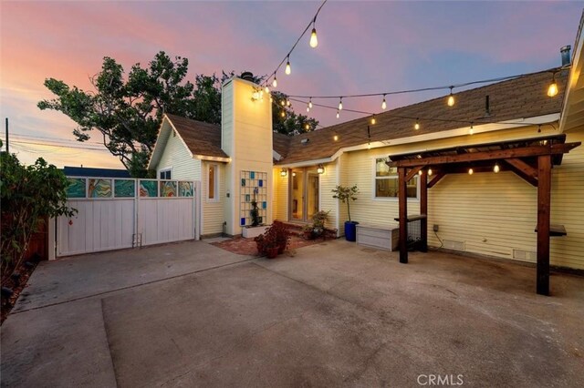 2322 246th St, Lomita, CA 90717 - back of house with a chimney and a gate