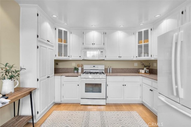2322 246th St, Lomita, CA 90717 - kitchen with white appliances, recessed lighting, glass insert cabinets, light wood finished floors, and white cabinets