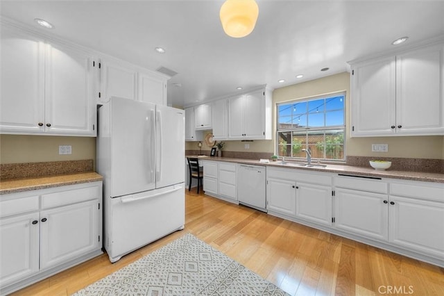 2322 246th St, Lomita, CA 90717 - kitchen with white appliances, light wood-type flooring, white cabinets, and recessed lighting