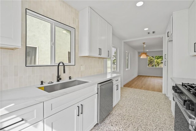 7312 Loch Alene Ave, Pico Rivera, CA 90660 - kitchen with dishwasher, stove, backsplash, white cabinets, and recessed lighting