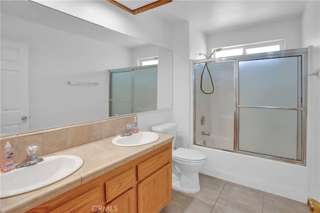 14480 Nevada Rd, Phelan, CA 92371 - bathroom featuring double vanity, enclosed tub / shower combo, healthy amount of natural light, and tile patterned flooring