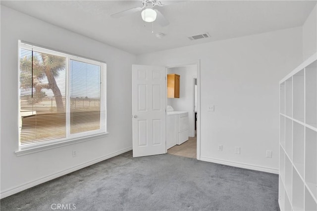 14480 Nevada Rd, Phelan, CA 92371 - unfurnished bedroom featuring washing machine and dryer, carpet floors, and a ceiling fan