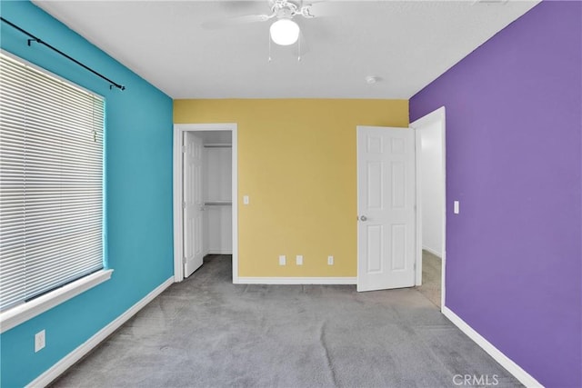 14480 Nevada Rd, Phelan, CA 92371 - unfurnished bedroom featuring carpet, multiple windows, a spacious closet, and a closet