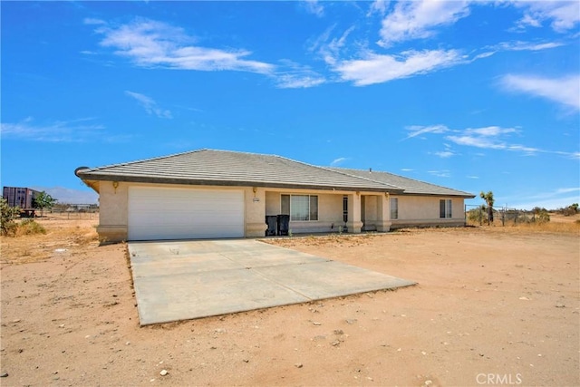 14480 Nevada Rd, Phelan, CA 92371 - single story home with an attached garage, concrete driveway, a tile roof, and stucco siding