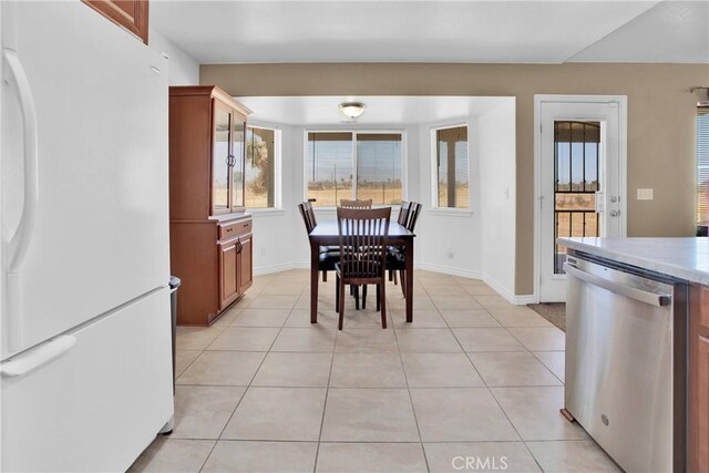 14480 Nevada Rd, Phelan, CA 92371 - dining room featuring light tile patterned floors and baseboards