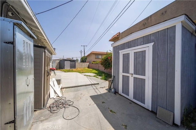6838 Severn Dr, Paramount, CA 90723 - view of patio / terrace with a storage shed