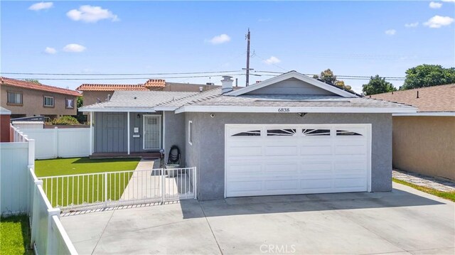 6838 Severn Dr, Paramount, CA 90723 - ranch-style home with concrete driveway, a fenced front yard, a garage, and stucco siding