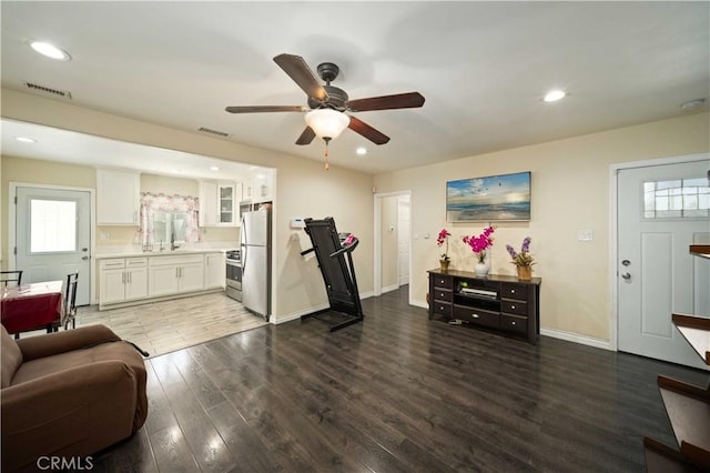 6838 Severn Dr, Paramount, CA 90723 - living area with ceiling fan, wood finished floors, and recessed lighting