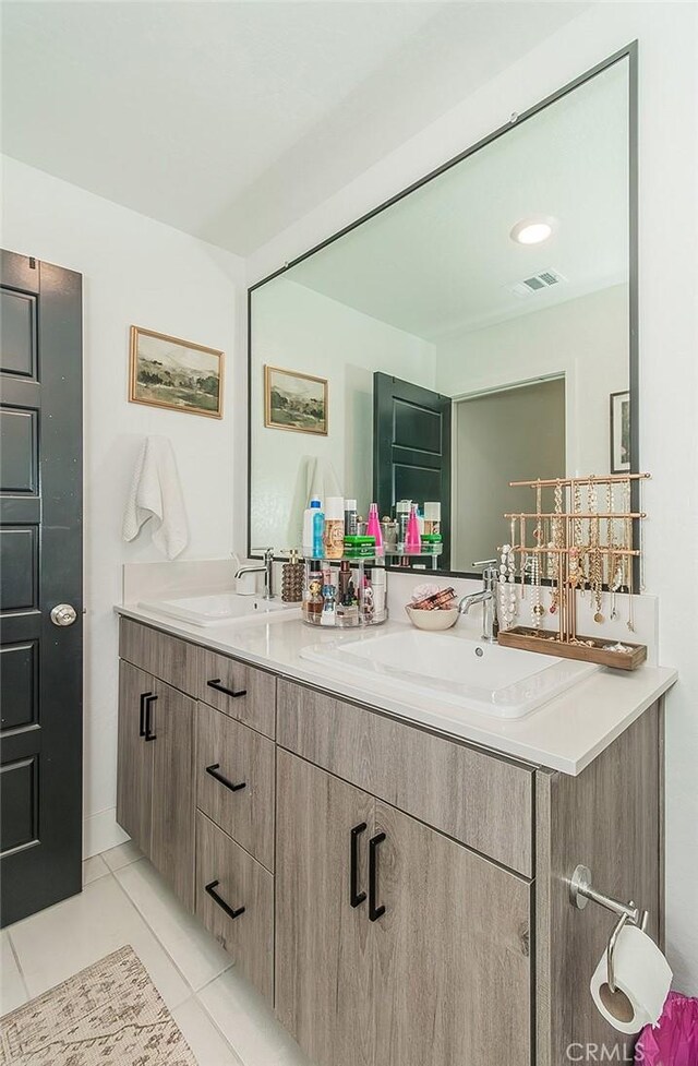 2887 E Tamarind Dr, Fresno, CA 93730 - bathroom with double vanity and tile patterned flooring
