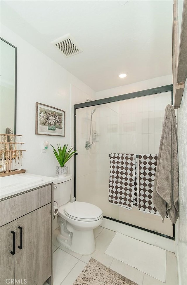 2887 E Tamarind Dr, Fresno, CA 93730 - full bathroom with vanity, tile patterned floors, a shower stall, and recessed lighting