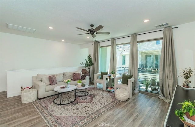 2887 E Tamarind Dr, Fresno, CA 93730 - living room featuring light wood finished floors, ceiling fan, and recessed lighting