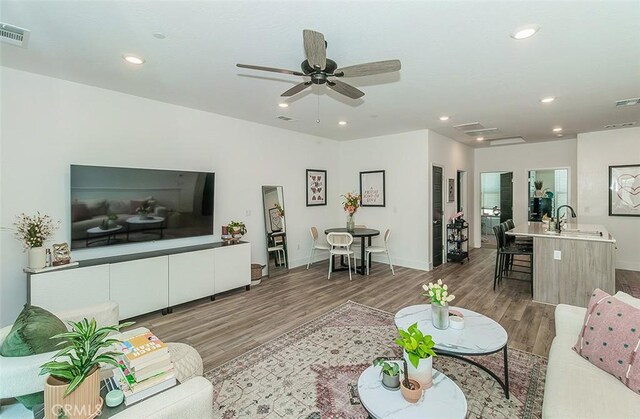 2887 E Tamarind Dr, Fresno, CA 93730 - living room featuring wood finished floors, recessed lighting, and ceiling fan