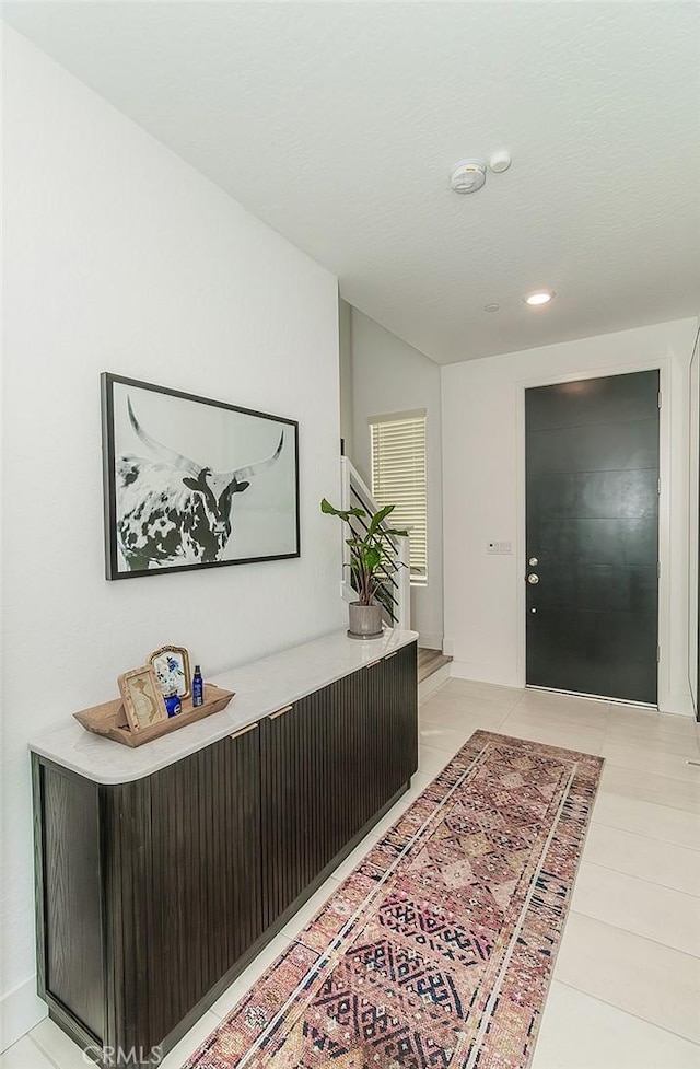 2887 E Tamarind Dr, Fresno, CA 93730 - foyer with light tile patterned floors and recessed lighting