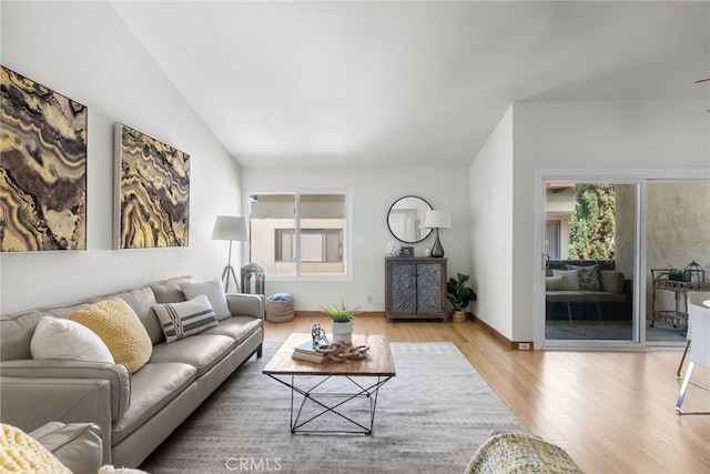 5650 Sumner Way Unit 309, Culver City, CA 90230 - living room with wood finished floors, plenty of natural light, and vaulted ceiling