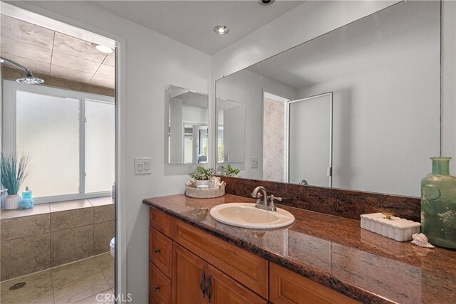 5650 Sumner Way Unit 309, Culver City, CA 90230 - full bath with vanity, a shower, healthy amount of natural light, and tile patterned flooring