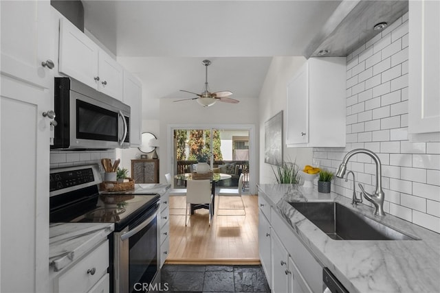 5650 Sumner Way Unit 309, Culver City, CA 90230 - kitchen with stainless steel appliances, a ceiling fan, and white cabinetry
