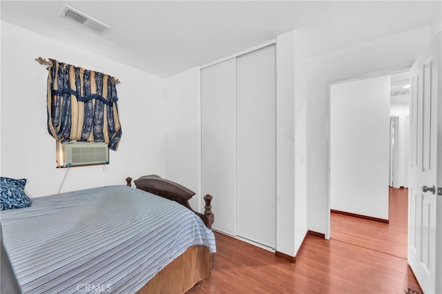3739 Cherisa St, Perris, CA 92571 - bedroom with cooling unit, wood finished floors, and a closet