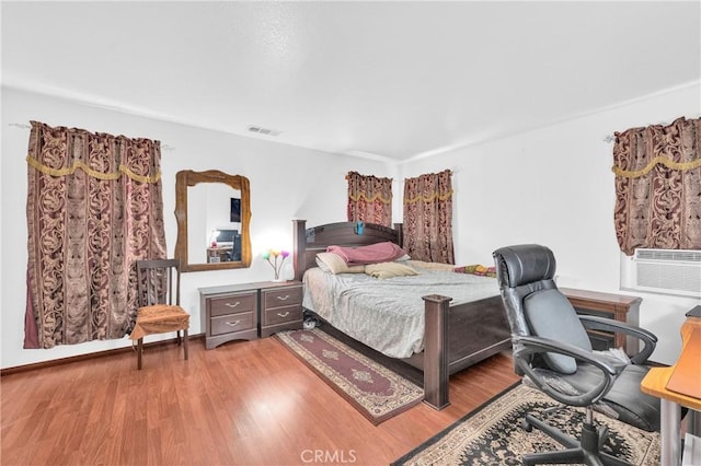 3739 Cherisa St, Perris, CA 92571 - bedroom featuring wood finished floors, an office area, and cooling unit