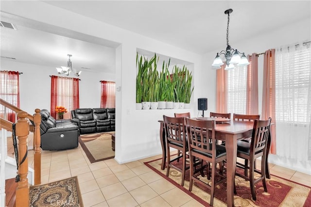 3739 Cherisa St, Perris, CA 92571 - dining room featuring a chandelier and light tile patterned flooring