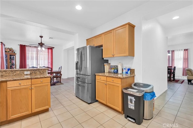 3739 Cherisa St, Perris, CA 92571 - kitchen with stainless steel fridge, light tile patterned flooring, ceiling fan, light stone counters, and recessed lighting