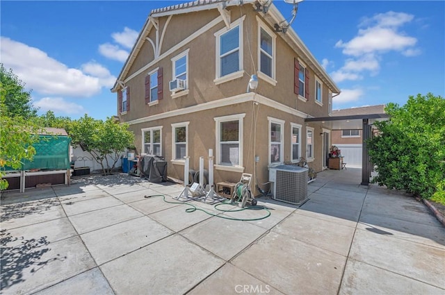 3739 Cherisa St, Perris, CA 92571 - back of house with stucco siding, a patio, and cooling unit